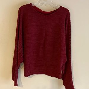 Gorgeous crimson see through back detail elevated top.